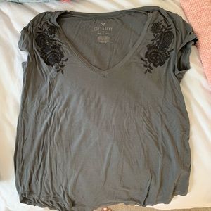 gray t shirt with black floral print
